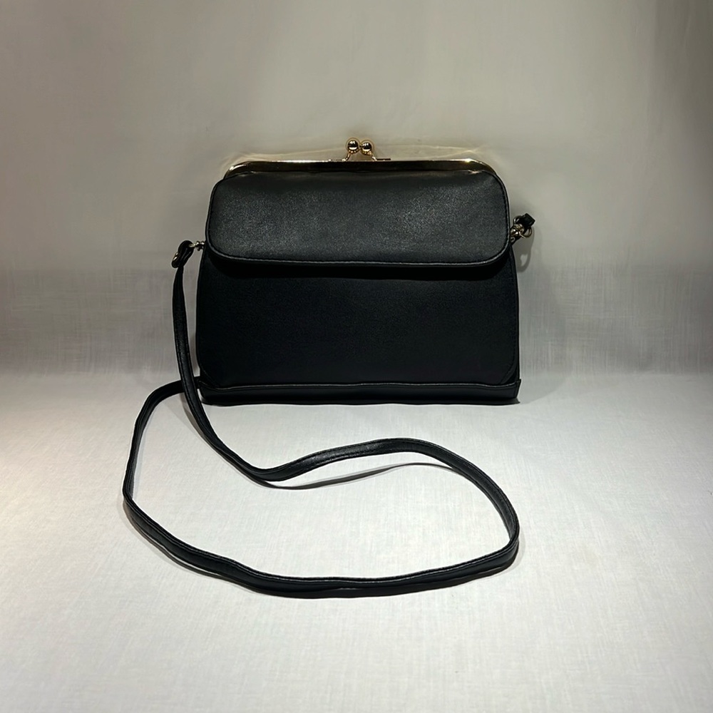 Black leather purse with gold accents